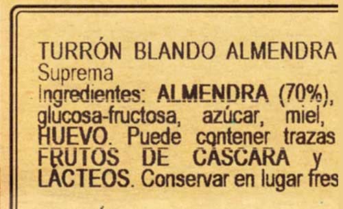 Porcentaje de almendras en una barra de turrón del blando.